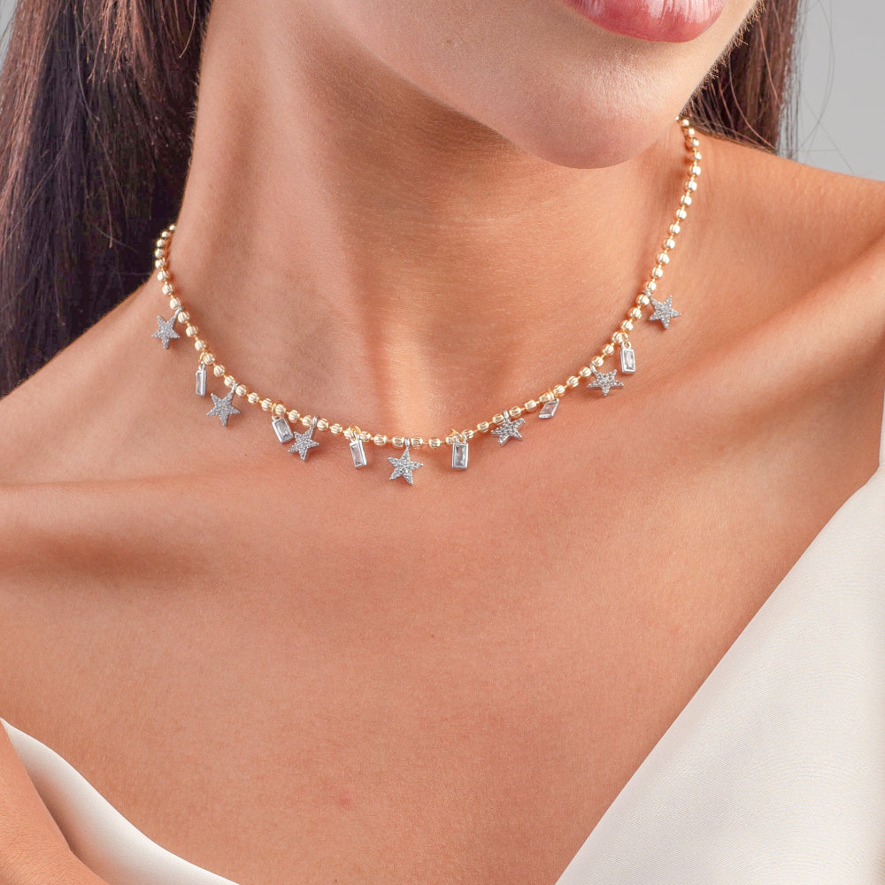 Necklace with star-shaped pendants worn by a person