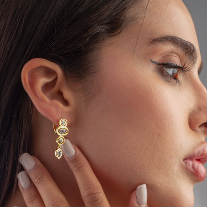 Quatro Stones dangling huggie